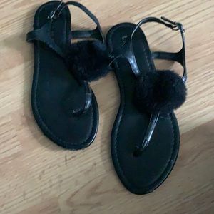 Black sandals with a puff